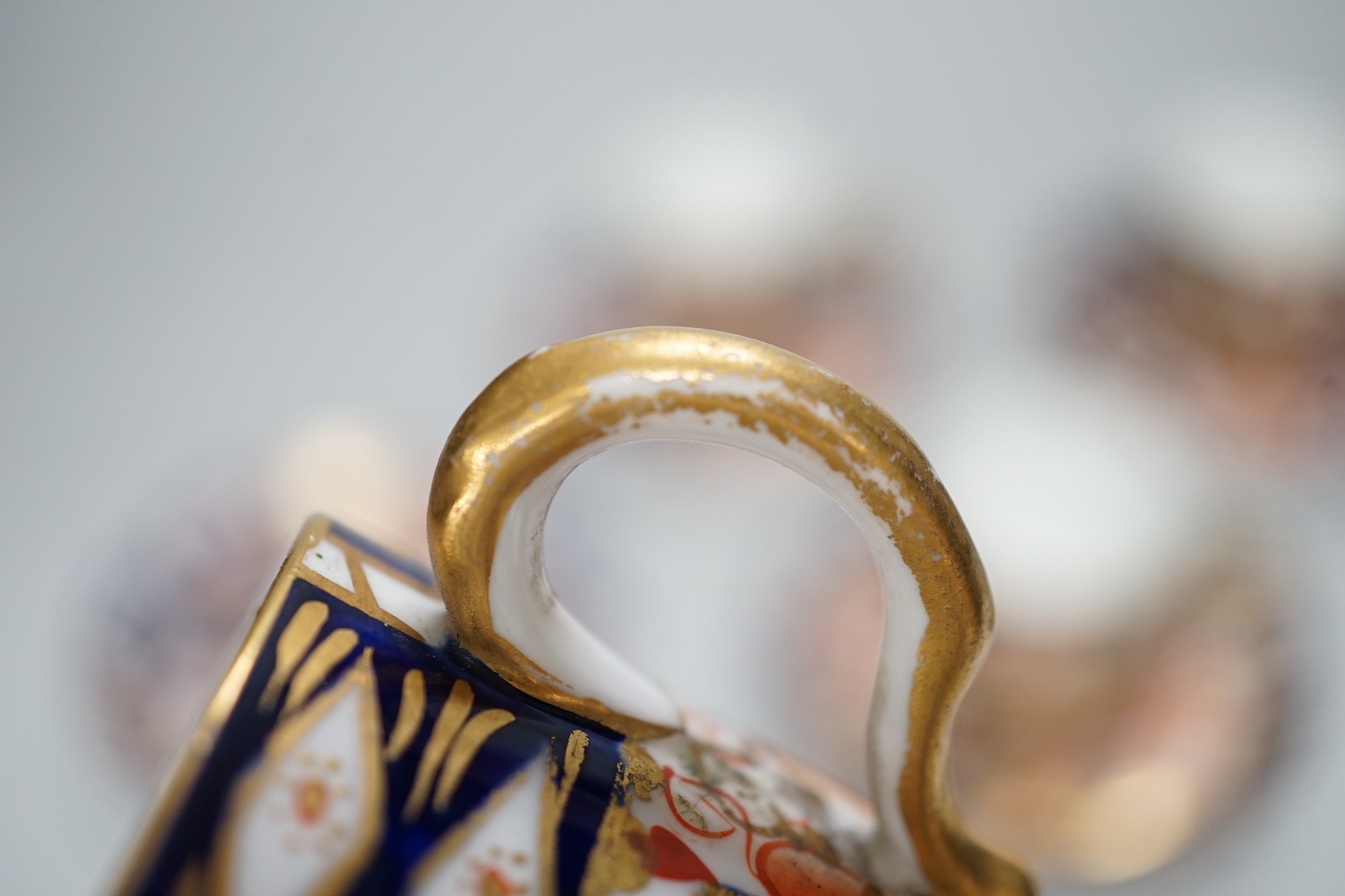 Five Royal Crown Derby Imari coffee cans and saucers